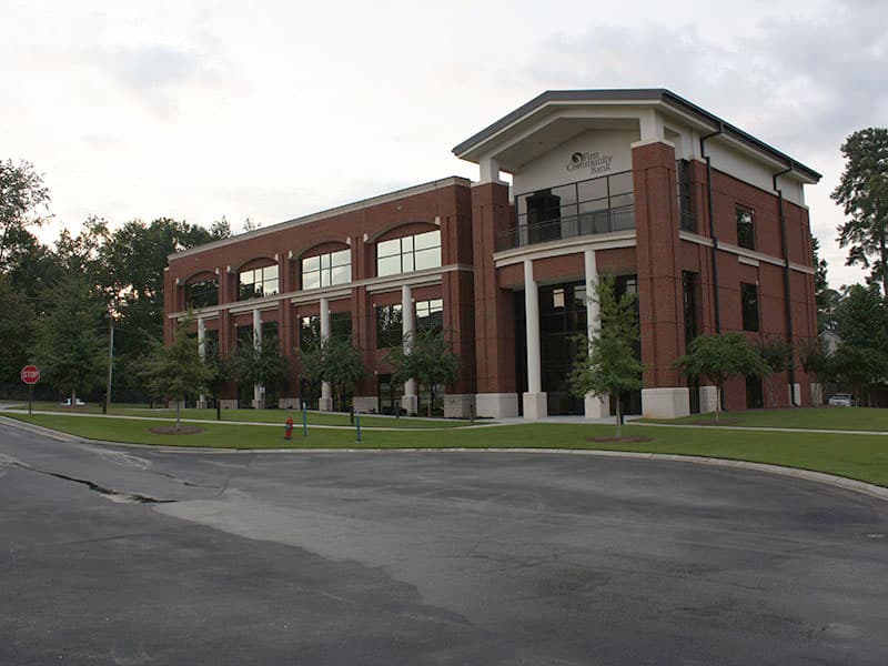 Commercial building with maintained turf and landscaped grounds