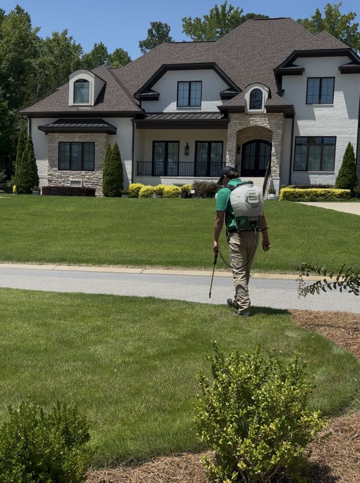 GLS Turf technician treating a residential lawn in Lexington, South Carolina
